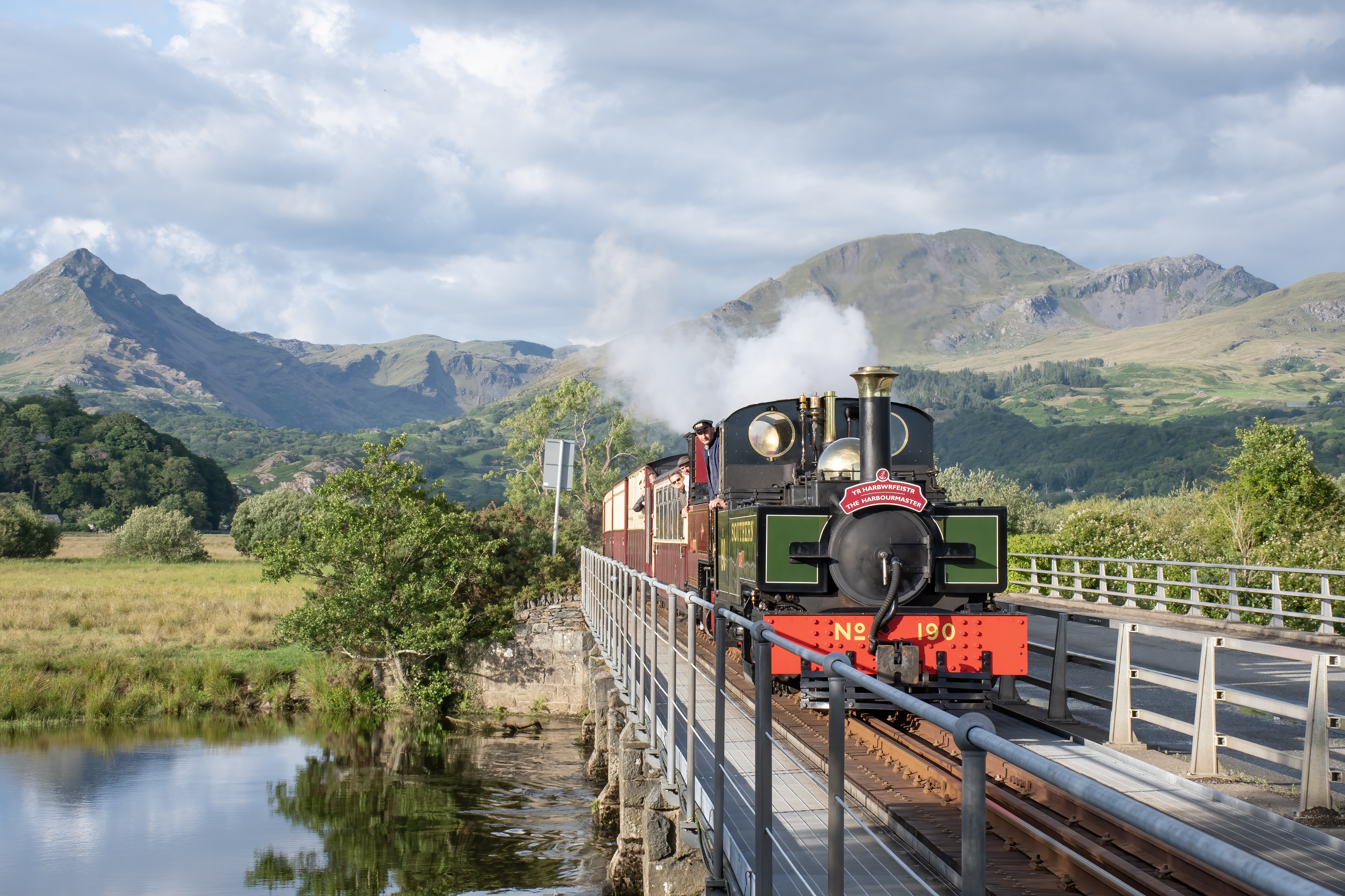 A view of Snowdonia/Eryri with a steam train hauled by a pair of locomotives during a special event celebrating the railway’s centenary